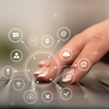 CleanMyMac 3 Review mac utility woman typing on black laptop keyboard icons around 